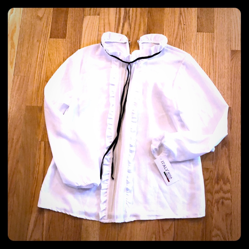 White ruffled blouse